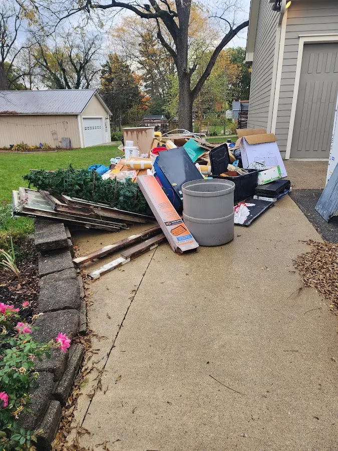 Dumpster being loaded with debris for Commercial Dumpster Rental in La Vergne